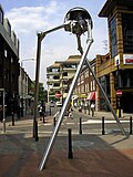 Image 80Statue of a tripod from The War of the Worlds in Woking, England, the hometown of author H. G. Wells. The book is a seminal depiction of a conflict between mankind and an extraterrestrial race. (from Culture of the United Kingdom)