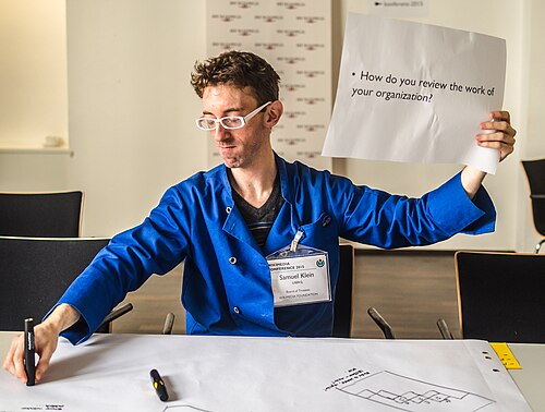 WMF trustee SJ does a balancing act during the "Meet the WMF Board of Trustees" session. Official session notes are here. It looks like participants discussed some topics that are similar to those from the Board Governance session.