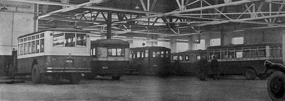 Early buses inside a building