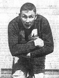A picture of Johnny Lattner playing football.