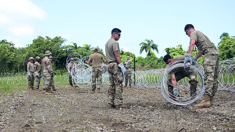 File:346th AEW lay concertina wire.jpg
