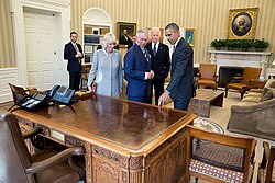  Barack Obama, Joe Biden, Prince Charles, and Duchess Camilla stand behind the Resolute desk