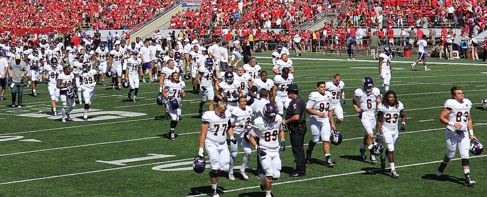File:Western Illinois leaves Camp Randall 2014.jpg
