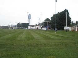 A colour photo of a cricket ground