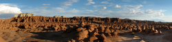 hundreds of sandstone hoodoos protruding from the desert floor.
