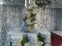 Another view of the "calvaire" type sculpture. Note the angel with chalice collecting blood from Jesus' feet