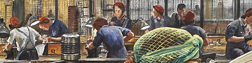 Close-up of the background, showing a line of women working in the factory