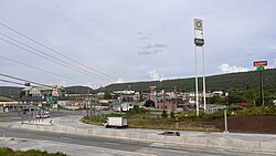 The stretch of U.S. Route 30 in Breezewood, Pennsylvania (looking east), is one of the few gaps in the Interstate Highway System. Interstate 70 traffic uses this surface street to connect the untolled interstate highway with the Pennsylvania Turnpike.