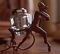 Two small devils carrying an inkwell between them. Norsk Folkemuseum, Ibsenmuseet (NF.1914-0488).