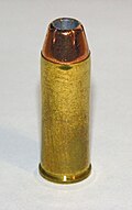 .45 Colt cartridge featuring a jacketed hollow point bullet