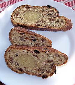 Dutch kerststol slices with almond paste filling