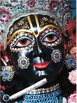 Krishna is depicted in black skin in murti, in accordance with the name which means "dark".