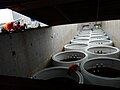 Loading of wind mills faundations in cargo hold of MS Ant during the drizzling. Aveiro port, cyclonic activity. Dated 6 of January 2011.