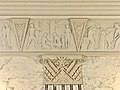 Ground level cornice panel depicting First Nations people