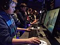 Casual players playing a shooter at the 2013 Intel Extreme Masters in Katowice, Poland