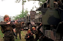 Ukrainian army soldiers wearing bandanas during a military exercise