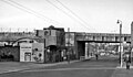 The Brentford station site in 1961, as viewed eastwards from the A315 London Road. The station closed in May 1942, and the platform buildings were demolished in 1957. The bridge over the road was removed in 1965 when the line south of Brentford Town Goods was dismantled.