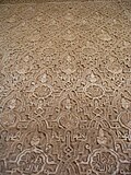 Sebka pattern filled with other motifs in carved stucco decoration at the Alhambra in Granada, Spain (14th century)