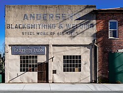 Plastered façade of a functional historic workshop in Chico, California