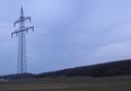 Suspension tower of a 110 kV-line with garland-like communication cable on the ground conductor