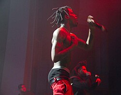 American rapper Travis Scott sagging his pants while performing in 2015