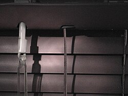 Detail of turning rod (blind stick) attachment on miniblind