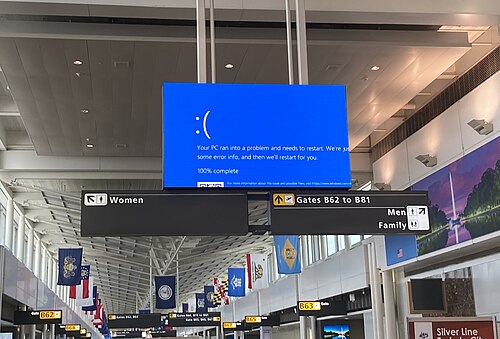 Digital signage at Dulles International Airport displaying a blue screen of death during the incident