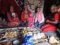 Women and children eating in Suusamyr Valley
