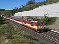 EC 370 (hauled by ČD electric locomotive class 371) to Berlin and Åarhus is leaving the new high speed track tunnel near Mlčechvosty