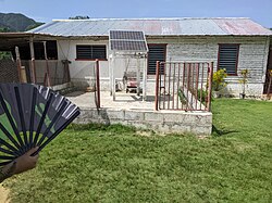 A makeshift power station in Cuba, consisting of a lead-acid battery, a solar panel, and a controller