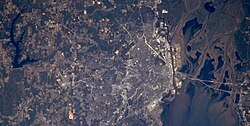 Large L-shaped lake miles West of Mobile as seen from space