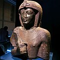 This statue shows a young Ramesses II holding the Heka Sceptre.