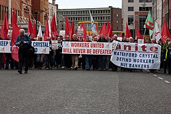 Protestors with banners marching on the streets of Dublin