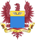 águila color vinotinto, al igual que el pico, lengua, y uñas; Alas grises; letras negras. El azul y el amarillo del escudo están bien