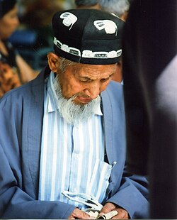 A man wearing a Chust doppa in Shahrisabz, Uzbekistan