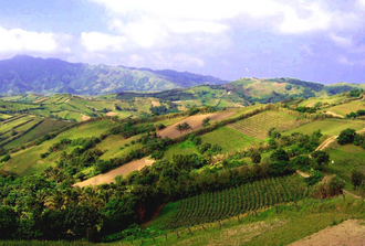 The hilly landscape of Batan Island with Mount Matarem in the distant left