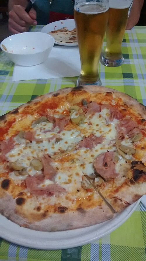 File:Pizza and beer in Esino Lario.jpg