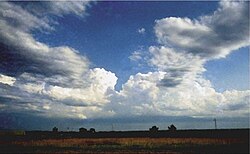 Photograph of distant formative thunderstorms