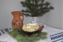 A bowl of cabbage rolls with a dollop of sour cream