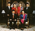 Image 114Formal family portrait of former Indonesian's President B.J. Habibie. Women wear kain batik and kebaya with selendang (sash), while men wear jas and dasi (western suit with tie) with peci cap. (from Culture of Indonesia)