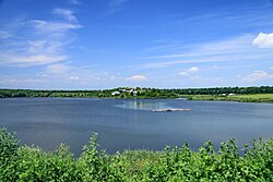View of Căldărușani Monastery across Lake Căldărușani