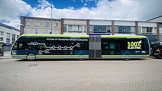 green articulated bus