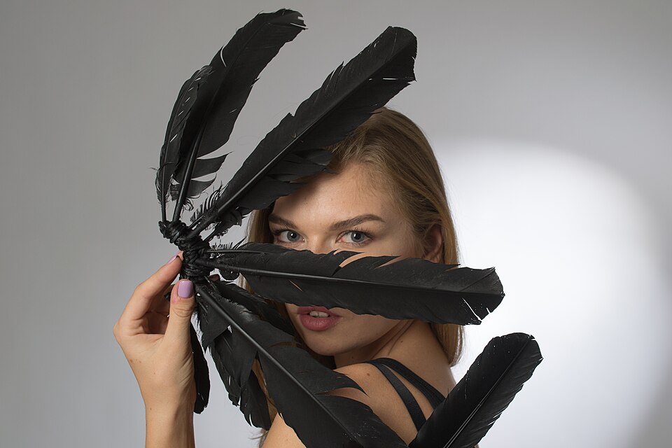 File:Female model with feathers.jpg