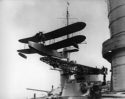 A Soviet Naval Aviation Heinkel KR-1 maritime patrol flying boat launches from a catapult mounted on a Parizhskaya Kommuna's 12-inch (305 mm) gun turret, 1930–1933