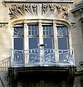 Wrought iron balcony and detail of the façade