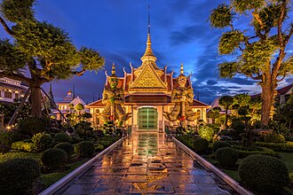 The sculptures of two mythical giant demons, Thotsakan and Sahatsadecha, guarding the eastern gate of the main chapel of Wat Arun, Bangkok
