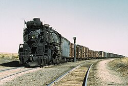 Santa Fe Railroad 2-10-4 locomotive #5000 "Madame Queen" pulling a freight train in New Mexico
