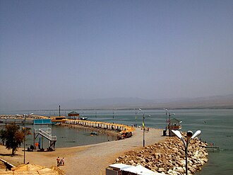 A pier extending out into Kayrakkum Reservoir