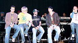 Boy bands and girl groups became a global pop cultural phenomenon in the 1990s, with groups such as Backstreet Boys, NSYNC, Boyz II Men, Spice Girls, TLC, and Destiny's Child dominating charts and shaping teen pop culture worldwide.