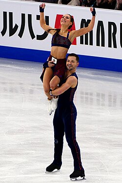 Lilah Fear and Lewis Gibson perform on the ice.